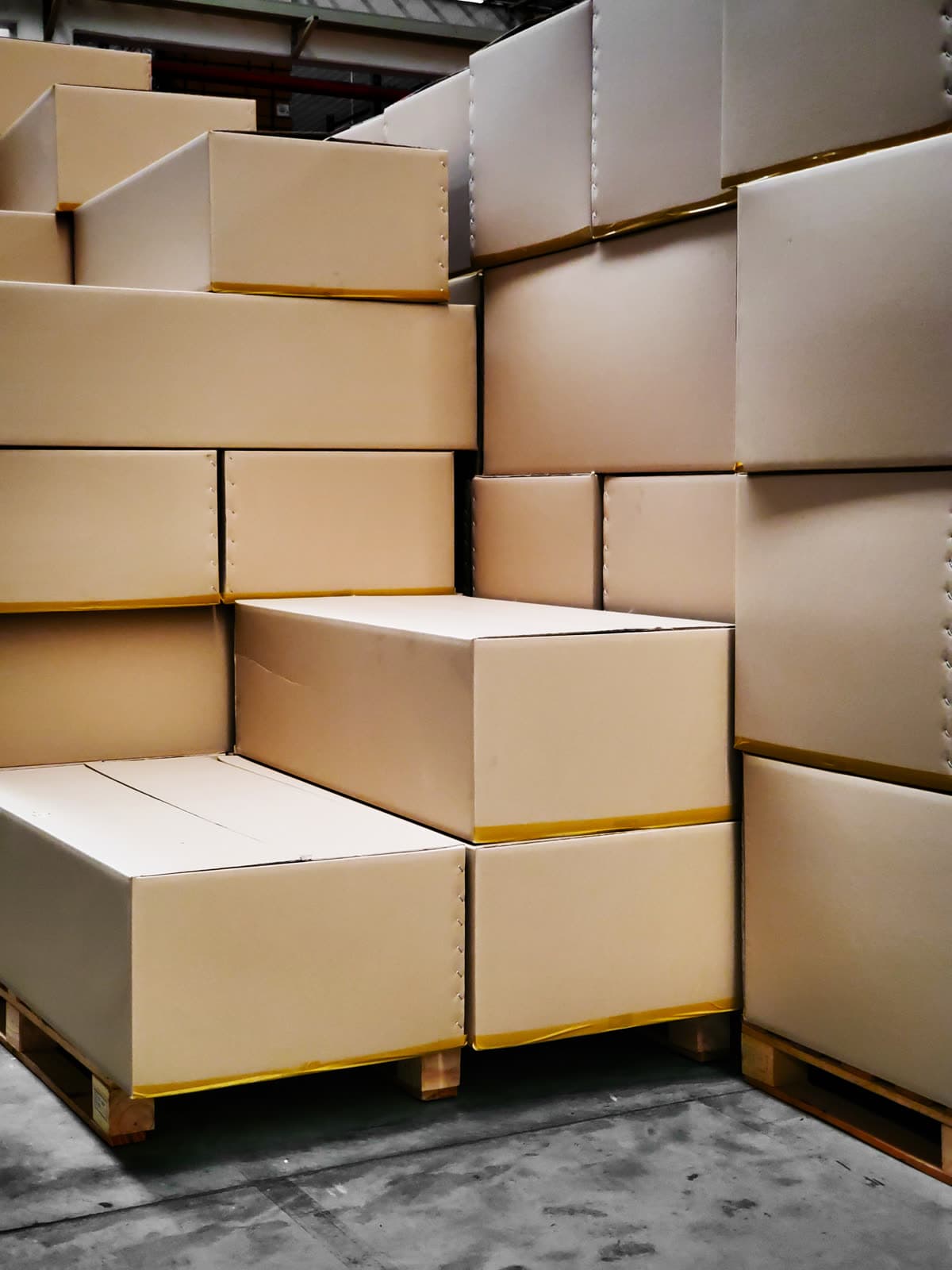 Stacks of packaging boxes inside an industrial factory